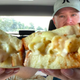 Man holding Mac and Cheese Sandwich up to camera